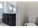 Bathroom with toilet, vanity, and shower/tub combo at 1224 Challenge Dr, Davenport, FL 33896