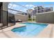 Inviting backyard oasis with a refreshing pool, screened enclosure, and patio furniture at 1224 Challenge Dr, Davenport, FL 33896