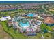 Community features expansive resort-style pool, expansive sandy beach area, and expansive lawn at 1224 Challenge Dr, Davenport, FL 33896