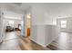 Upstairs hallway with wood-look floors and access to bedrooms and bathroom at 3248 Toscana Dr, St Cloud, FL 34772