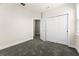 Simple bedroom with neutral walls, carpet, and double door closet at 7772 Sweet Star Ave, Orlando, FL 32836