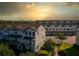 Modern townhouse exterior with sunset in background at 7772 Sweet Star Ave, Orlando, FL 32836