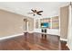 Gathering room with built-in shelving, hardwood floors and a large TV at 801 Lobelia Dr, Lake Mary, FL 32746