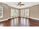 Bright living room with hardwood floors and large windows at 801 Lobelia Dr, Lake Mary, FL 32746