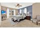 Bedroom with queen-size bed, neutral decor, and TV at 801 Lobelia Dr, Lake Mary, FL 32746