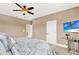 Bedroom with king-size bed, neutral decor, and TV at 801 Lobelia Dr, Lake Mary, FL 32746