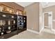 Well-lit hallway with built-in shelving and extra storage at 801 Lobelia Dr, Lake Mary, FL 32746