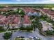 Drone shot of townhouses, roads, and a large body of water at 801 Lobelia Dr, Lake Mary, FL 32746
