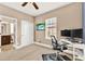Bright home office features built-in shelving and ensuite bathroom access at 801 Lobelia Dr, Lake Mary, FL 32746
