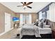 Main bedroom with king-size bed and neutral decor at 801 Lobelia Dr, Lake Mary, FL 32746