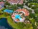 Aerial view of community pool, tennis courts, and clubhouse at 801 Lobelia Dr, Lake Mary, FL 32746