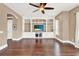 Gathering room with built-in shelving and hardwood floors at 801 Lobelia Dr, Lake Mary, FL 32746