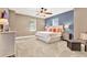 Spacious main bedroom with ceiling fan, plush carpeting, and ensuite bathroom at 801 Lobelia Dr, Lake Mary, FL 32746