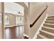 View of hardwood floors and a carpeted staircase leading to the upper level at 801 Lobelia Dr, Lake Mary, FL 32746