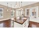 Spacious kitchen with granite countertops, white cabinets, and stainless steel appliances at 801 Lobelia Dr, Lake Mary, FL 32746