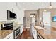 Modern kitchen with granite countertops, stainless steel appliances, and white cabinetry at 801 Lobelia Dr, Lake Mary, FL 32746