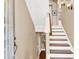 Shows an entryway with a staircase, hardwood floors, and neutral wall colors at 801 Lobelia Dr, Lake Mary, FL 32746