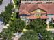 An aerial view of a townhouse nestled in a tree-lined neighborhood at 801 Lobelia Dr, Lake Mary, FL 32746