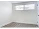 Bright bedroom with wood-look floors and large window at 1122 Lewis Dr, Daytona Beach, FL 32117