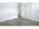 Bright bedroom with wood-look floors and double door closet at 1122 Lewis Dr, Daytona Beach, FL 32117