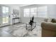Bright living room with neutral decor and large windows at 1122 Lewis Dr, Daytona Beach, FL 32117