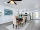 Open concept dining room with kitchen access and modern lighting at 1122 Lewis Dr, Daytona Beach, FL 32117