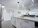 Kitchen island with seating and quartz countertops at 1122 Lewis Dr, Daytona Beach, FL 32117