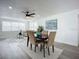 Open concept dining room with kitchen access and modern lighting at 1122 Lewis Dr, Daytona Beach, FL 32117