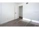 Bedroom with wood-look floors and access to closet at 1122 Lewis Dr, Daytona Beach, FL 32117