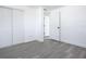 Bedroom with wood-look floors and closets at 1122 Lewis Dr, Daytona Beach, FL 32117