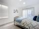 Spacious bedroom with wood-look floors and natural light at 1122 Lewis Dr, Daytona Beach, FL 32117