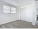 Simple bedroom with wood-look floors and double door closet at 1122 Lewis Dr, Daytona Beach, FL 32117