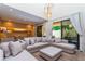 Spacious living room with sectional sofa and access to patio at 7527 Brooklyn Dr # 7527, Kissimmee, FL 34747
