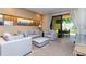 Living room with sectional sofa and access to backyard patio at 7527 Brooklyn Dr # 7527, Kissimmee, FL 34747