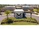 Modern community entrance with a prominent logo at 7527 Brooklyn Dr # 7527, Kissimmee, FL 34747