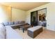 Covered patio with comfortable seating area and views to interior at 7527 Brooklyn Dr # 7527, Kissimmee, FL 34747