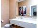 Modern bathroom with a floating vanity and large mirror at 7527 Brooklyn Dr # 7527, Kissimmee, FL 34747