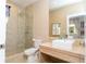 Clean bathroom with a walk-in shower, toilet and modern vanity at 7527 Brooklyn Dr # 7527, Kissimmee, FL 34747