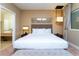 King-size bed, en-suite bathroom and neutral decor at 7527 Brooklyn Dr # 7527, Kissimmee, FL 34747