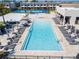 Resort-style pool with plenty of lounge chairs and umbrellas at 7527 Brooklyn Dr # 7527, Kissimmee, FL 34747