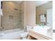 Bathroom with bathtub, toilet and modern vanity at 7527 Brooklyn Dr # 7527, Kissimmee, FL 34747