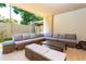 Relaxing outdoor patio with wicker furniture and a built-in grill at 7527 Brooklyn Dr # 7527, Kissimmee, FL 34747