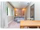 Spacious bonus room featuring a window, couch, and work area at 7527 Brooklyn Dr # 7527, Kissimmee, FL 34747