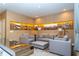 Light and airy living room with sectional sofa and city art at 7527 Brooklyn Dr # 7527, Kissimmee, FL 34747