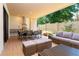 Covered patio with outdoor kitchen, dining area, and seating at 7527 Brooklyn Dr # 7527, Kissimmee, FL 34747