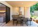 Covered patio with outdoor kitchen and dining table at 7527 Brooklyn Dr # 7527, Kissimmee, FL 34747
