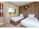 Twin bedroom with wood-paneled feature wall at 7527 Brooklyn Dr # 7527, Kissimmee, FL 34747