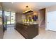 Modern kitchen with island, stainless steel appliances and chandelier at 7527 Brooklyn Dr # 7527, Kissimmee, FL 34747