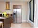 Modern kitchen features stainless steel appliances and an island at 7527 Brooklyn Dr # 7527, Kissimmee, FL 34747