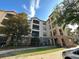 Apartment building with balconies and landscaping at 8020 Tuscany Way # 6103, Davenport, FL 33896